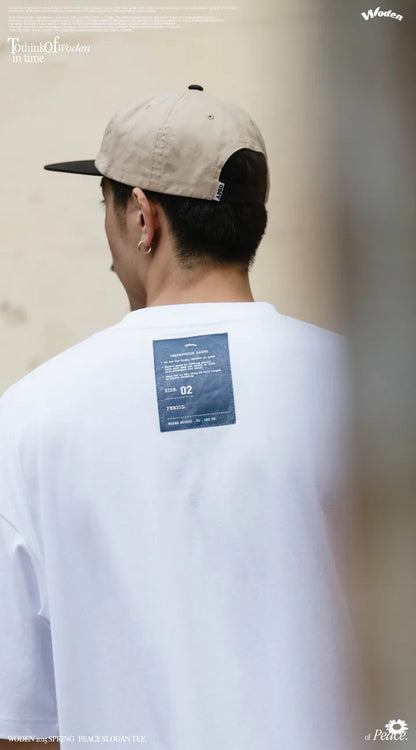 WODEN 2025 Spring & Summer 004 Peace Slogan Tee